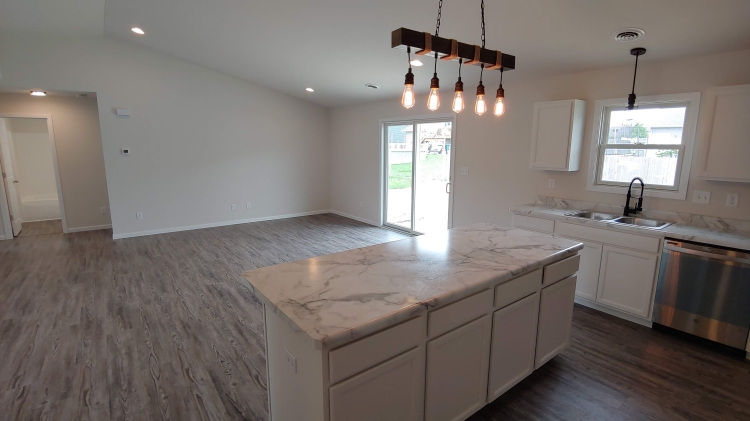 The Cheyenne - Family Room looking over island.